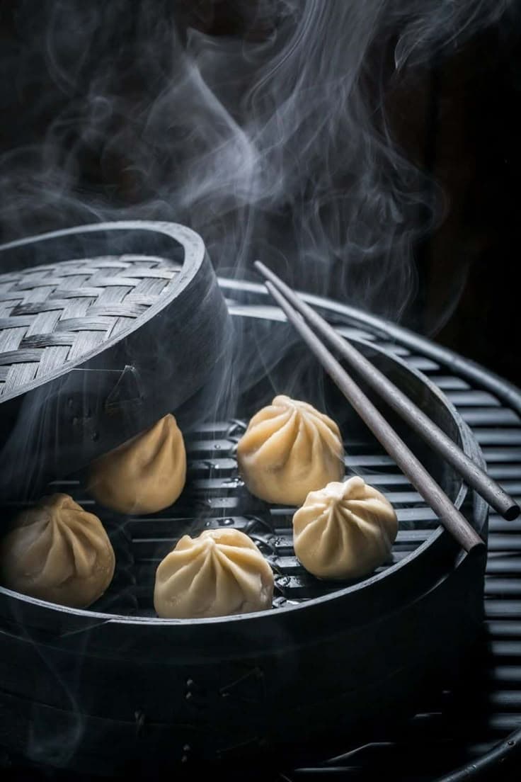 A plate of dumplings with smokey screen